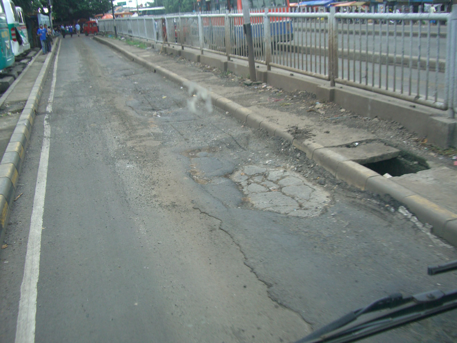 Fig. 23.9 TransJakarta, in Jakarta, Indonesia, initially used only asphalt and suffered from major problems of the roadway sinking and deteriorating at the stations, so the roadbed at the stations was repaved using concrete.