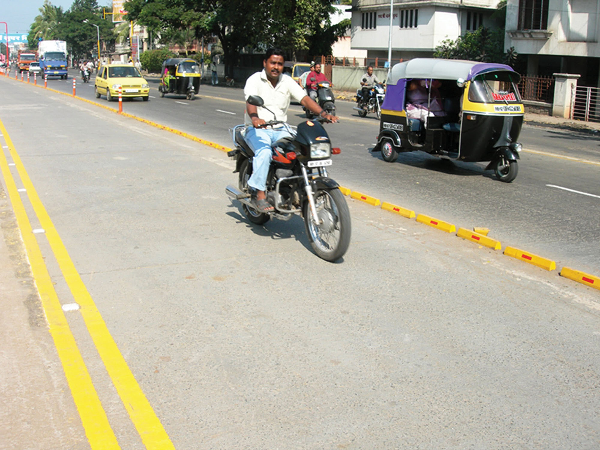 Fig. 23.14 Motorcycle illegally entering the busway in Pune, India.
