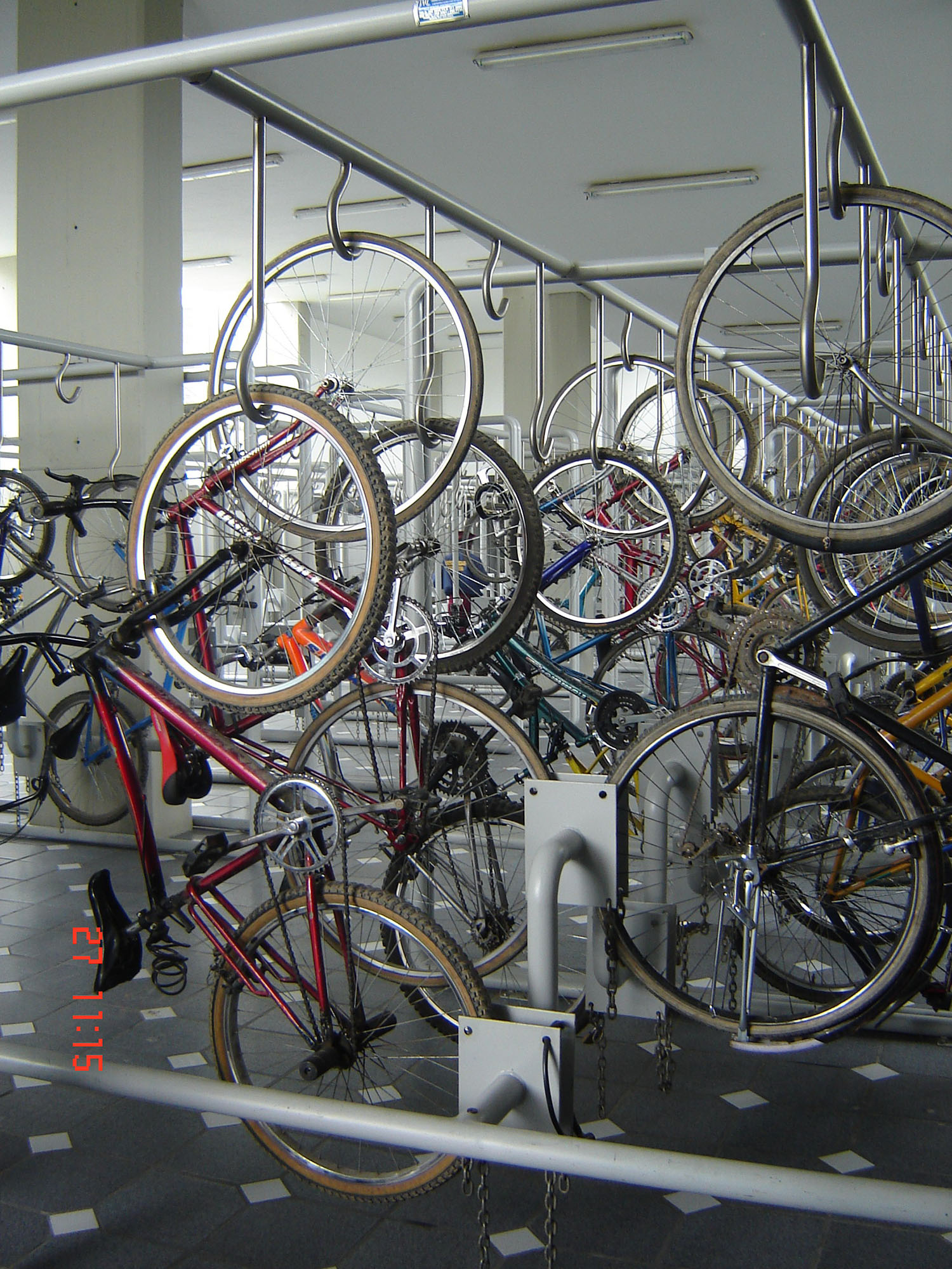 Fig. 31.33 Upright bicycle parking at TransMilenio stations in Bogotá saves space, but can be difficult for some to use.
