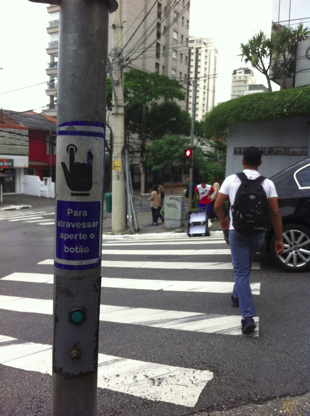 Fig. 24.9 As an example of actuation, pedestrians may “call the controller for a service” by pressing a button, as in this crossing in São Paulo.