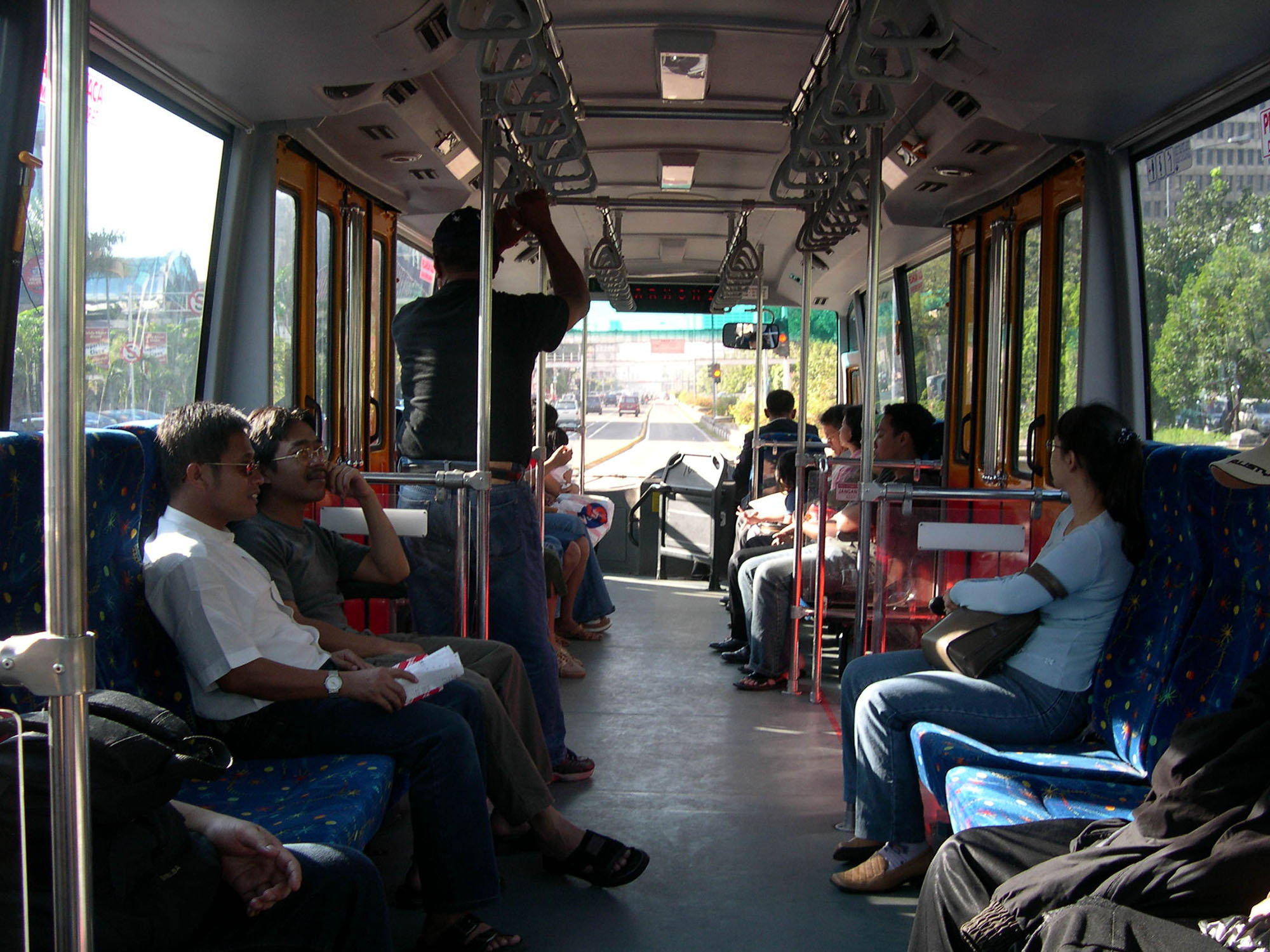 Fig. 20.16 Side-facing seating, as shown in this example from Jakarta, Indonesia, will tend to maximize space for standing customers, and thus such a configuration will maximize overall customer capacity per vehicle.